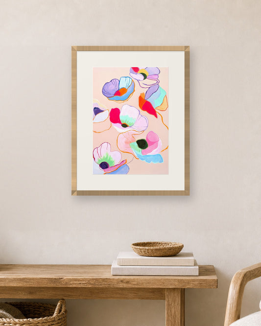 Floating Poppies by Amber Miro, fine art print shown in a natural oak frame with a white mat (frame not included)