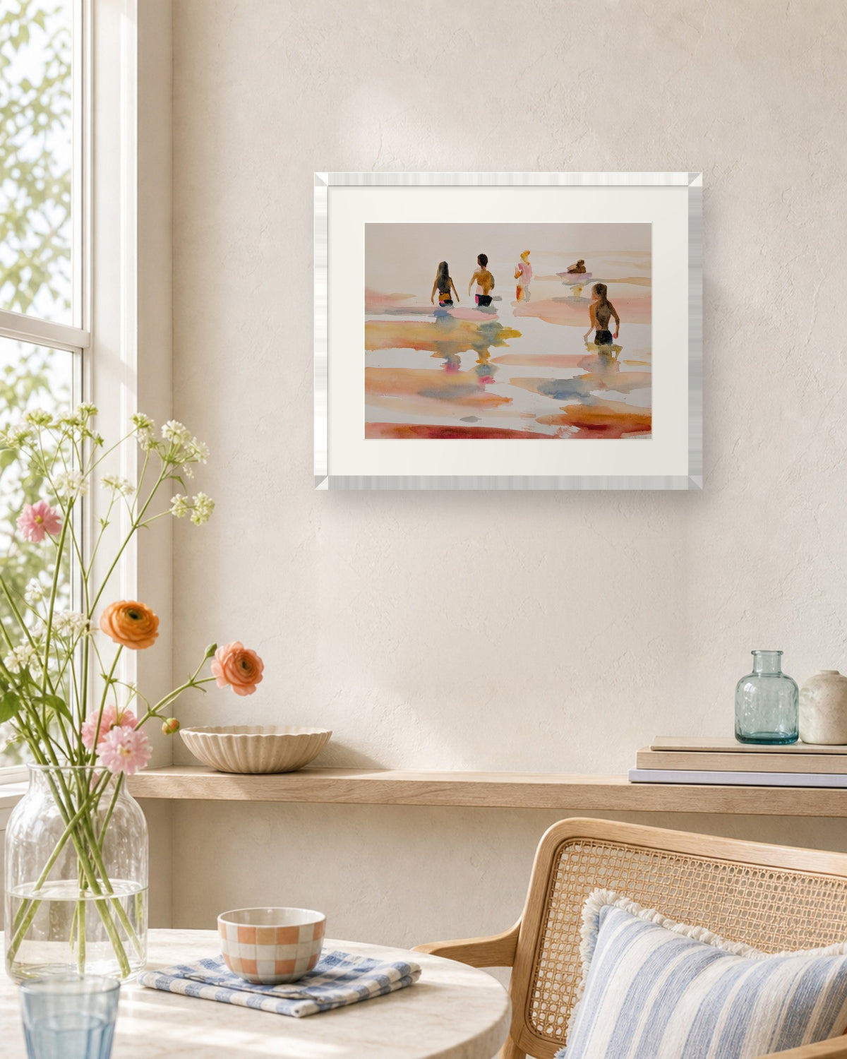 Last Swims of Summer by Amber Miro, original watercolor in a white frame on a sunlit wall by a window