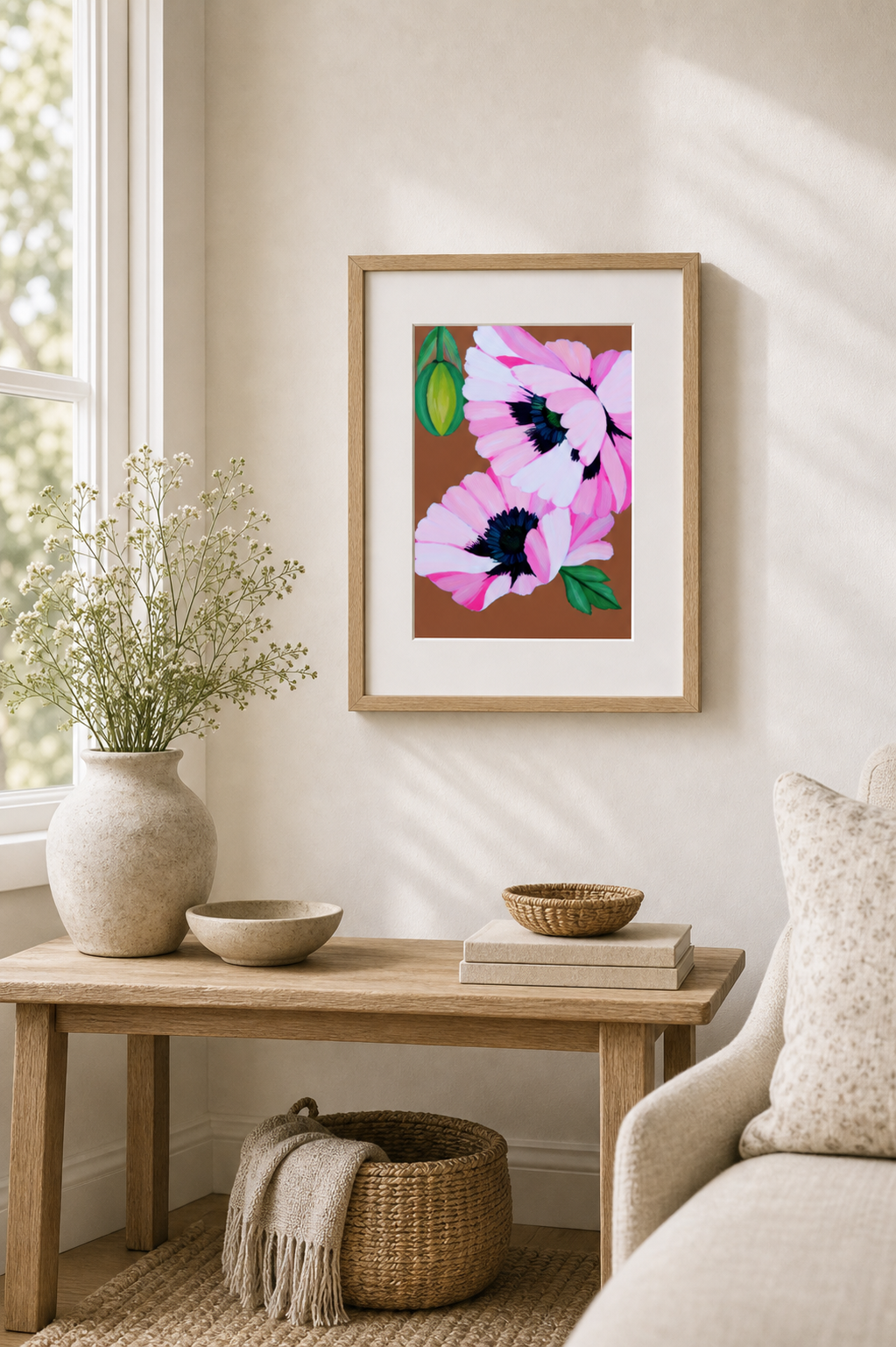 Floppy Poppies by Amber Miro, original pink poppy painting on earthy brown, framed above a wooden console by a window