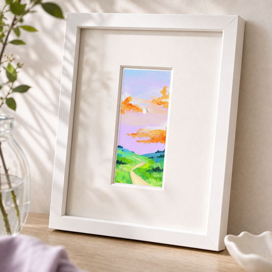 Purple Sunset by Amber Miro, original tiny painting of a purple and pink sky, angled view in a white frame with white mat