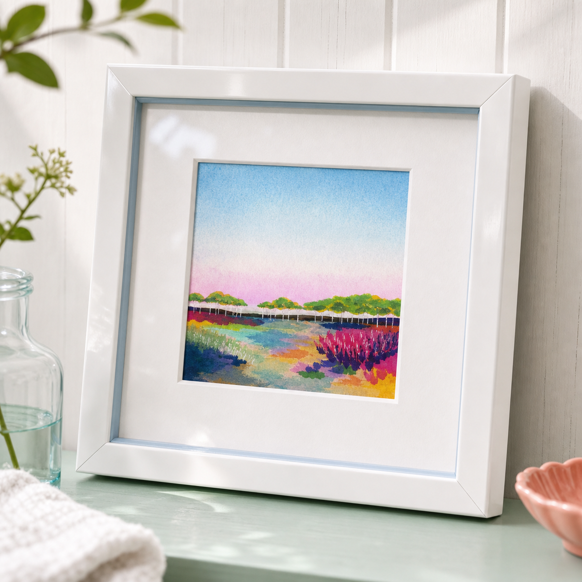 Walden by Amber Miro, fine art print of the Walden Pond footbridge, angled in a white frame on a mint shelf