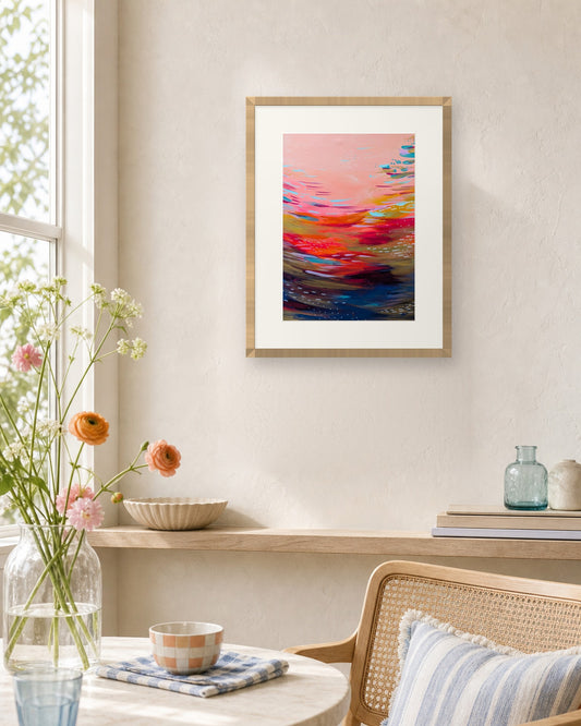 Sunsets at Sea by Amber Miro, fine art print shown in a natural oak frame with a white mat (frame not included)